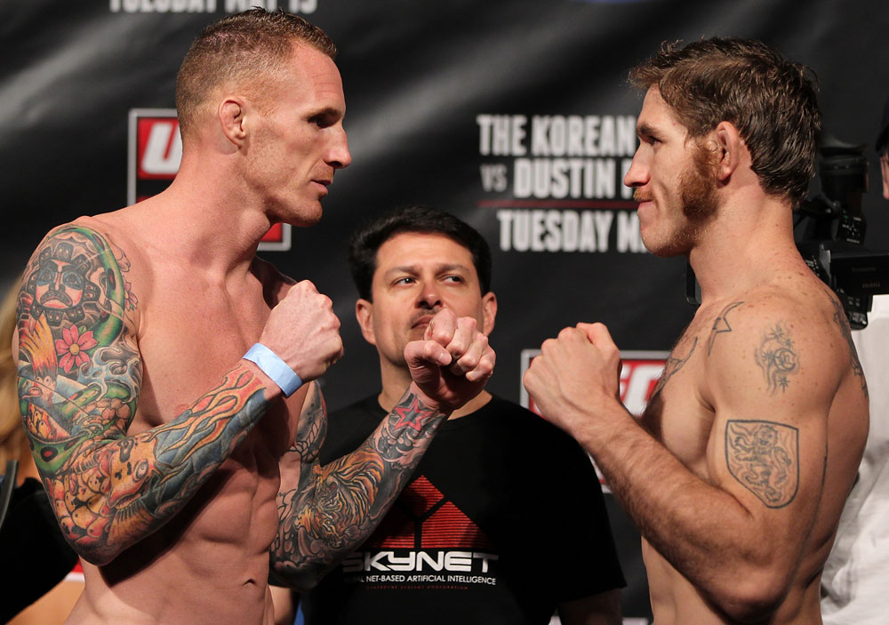 FAIRFAX, VA - MAY 14: (L-R) Middleweight opponents Jason MacDonald and Tom Lawlor face off after weighing in during the UFC on Fuel TV official weigh in at Patriot Center on May 14, 2012 in Fairfax, Virginia. (Photo by Josh Hedges/Zuffa LLC/Zuffa LLC via Getty Images)