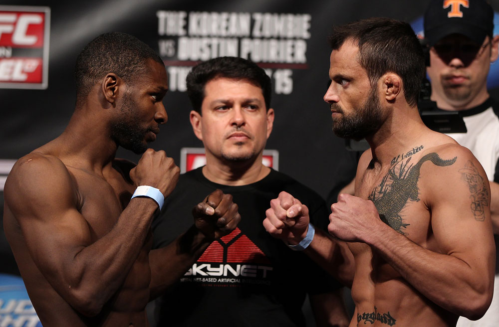 FAIRFAX, VA - MAY 14:  (L-R) Bantamweight opponents Yves Jabouin and Jeff Hougland face off after weighing in during the UFC on Fuel TV official weigh in at Patriot Center on May 14, 2012 in Fairfax, Virginia.  (Photo by Josh Hedges/Zuffa LLC/Zuffa LLC via Getty Images)