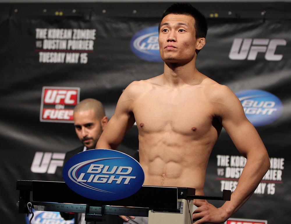 FAIRFAX, VA - MAY 14: "The Korean Zombie" Chan Sung Jung makes weight during the UFC on Fuel TV official weigh in at Patriot Center on May 14, 2012 in Fairfax, Virginia. (Photo by Josh Hedges/Zuffa LLC/Zuffa LLC via Getty Images)