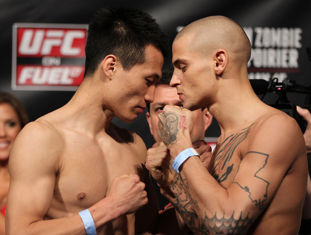 FAIRFAX, VA - MAY 14:  (L-R) Featherweight opponents "The Korean Zombie" Chan Sung Jung and Dustin Poirier face off after weighing in during the UFC on Fuel TV official weigh in at Patriot Center on May 14, 2012 in Fairfax, Virginia.  (Photo by Josh Hedges/Zuffa LLC/Zuffa LLC via Getty Images)