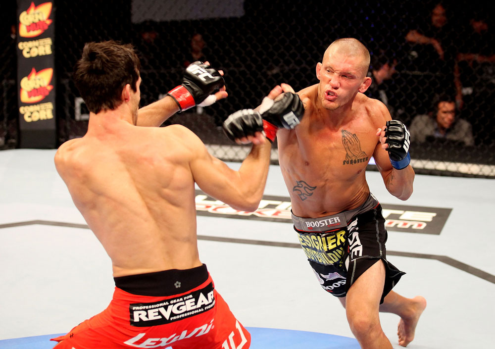 ATLANTIC CITY, NJ - JUNE 22:  Dustin Pague throws a punch at Ken Stone in a bantamweight bout during UFC on FX 4 at Revel Casino on June 22, 2012 in Atlantic City, New Jersey.  (Photo by Nick Laham/Zuffa LLC/Zuffa LLC)