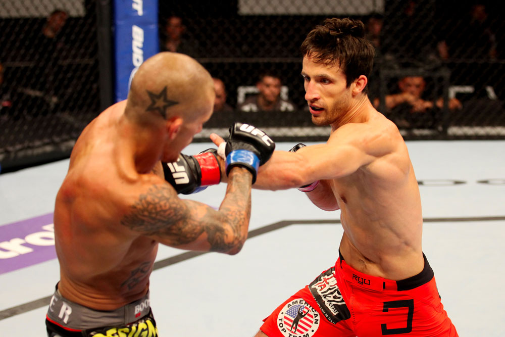 ATLANTIC CITY, NJ - JUNE 22: Ken Stone (R) punches Dustin Pague (L) in a bantamweight bout during UFC on FX 4 at Revel Casino on June 22, 2012 in Atlantic City, New Jersey.  (Photo by Nick Laham/Zuffa LLC/Zuffa LLC)