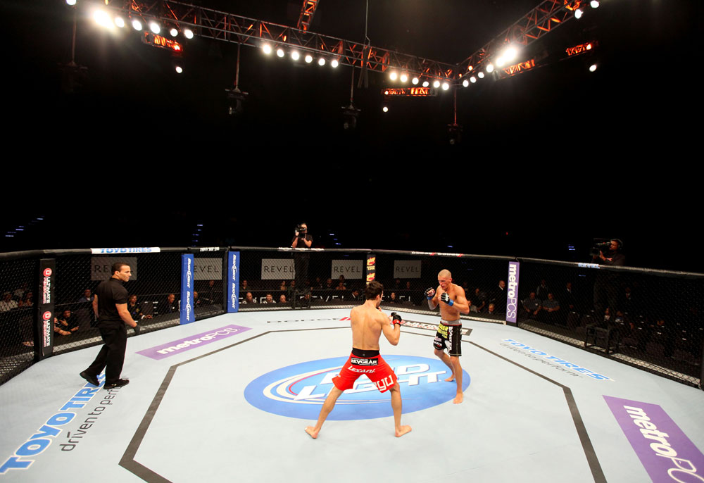 ATLANTIC CITY, NJ - JUNE 22:  Ken Stone (C) circles the octgagon with Ricardo Funch (R) as referee Gasper Oliver (L) looks on in a bantamweight bout during UFC on FX 4 at Revel Casino on June 22, 2012 in Atlantic City, New Jersey.  (Photo by Nick Laham/Zuffa LLC/Zuffa LLC)