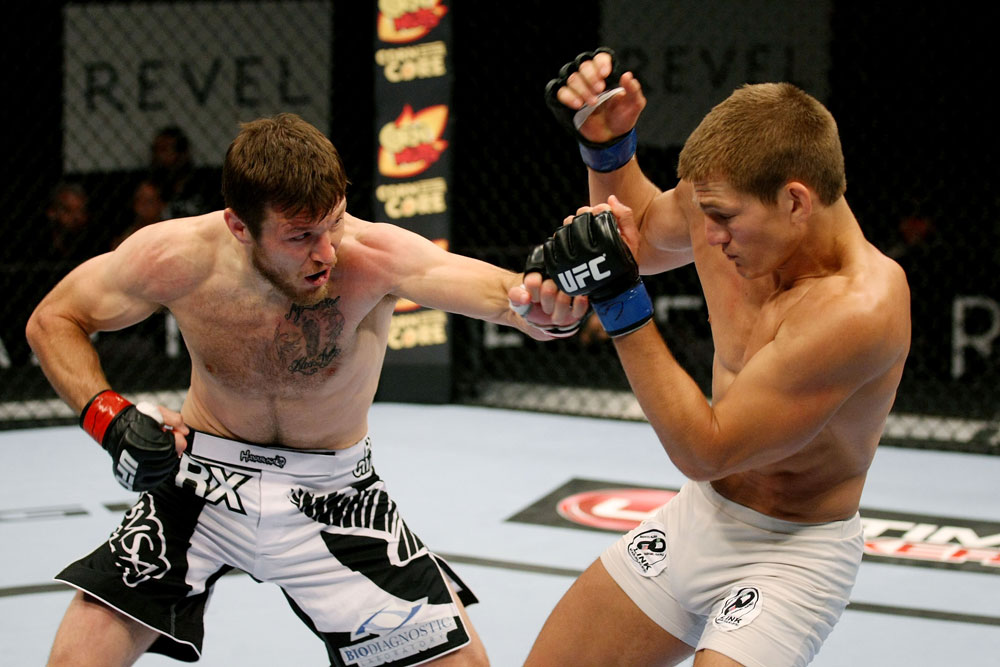 ATLANTIC CITY, NJ - JUNE 22: Dan Miller (L) throws a punch at Ricardo Funch (R) in a welterweight bout during UFC on FX 4 at Revel Casino on June 22, 2012 in Atlantic City, New Jersey.  (Photo by Nick Laham/Zuffa LLC/Zuffa LLC)