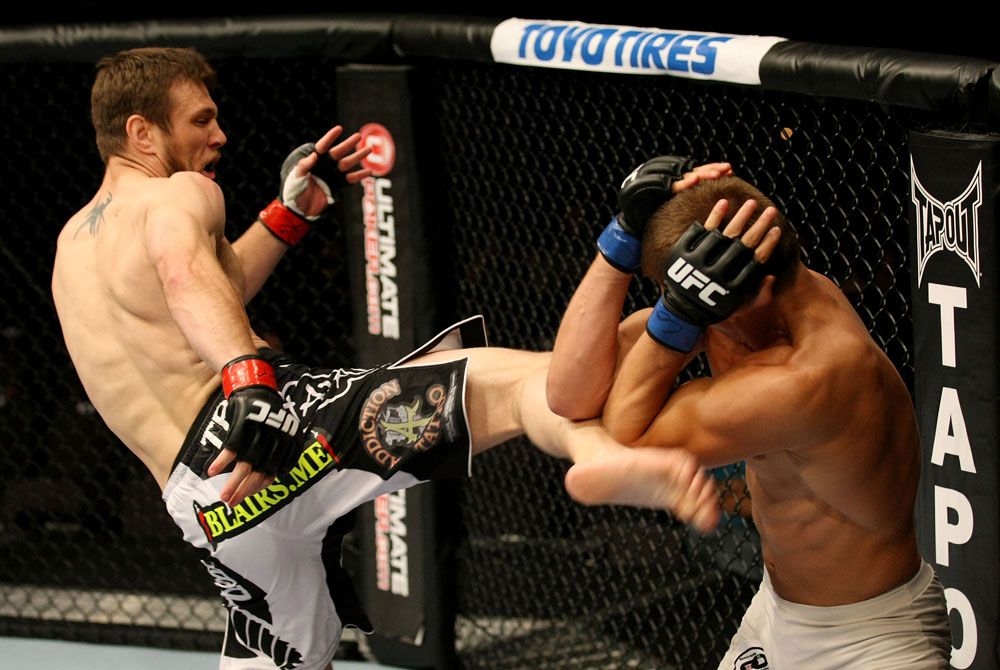 ATLANTIC CITY, NJ - JUNE 22:  Dan Miller (L) kicks Ricardo Funch (R) in a welterweight bout during UFC on FX 4 at Revel Casino on June 22, 2012 in Atlantic City, New Jersey.  (Photo by Nick Laham/Zuffa LLC/Zuffa LLC)