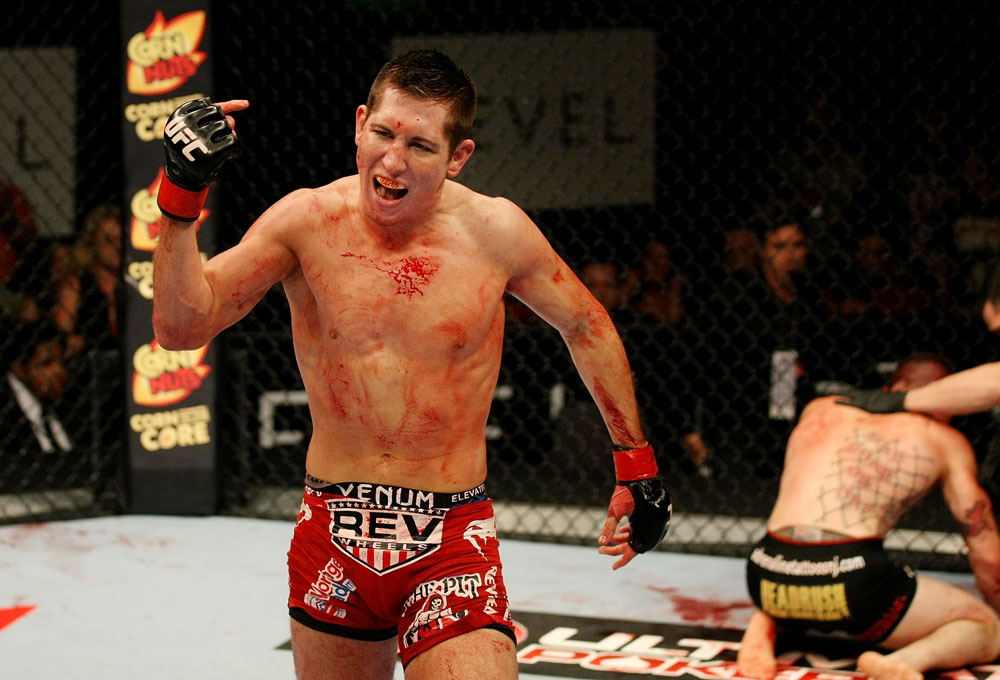ATLANTIC CITY, NJ - JUNE 22:  Steven Siler (L) celebrates his win by submission guillotine choke as Joe Gambino (C) is tended to by referee Kevin Mulhall (R) in a featherweight bout during UFC on FX 4 at Revel Casino on June 22, 2012 in Atlantic City, New Jersey.  (Photo by Nick Laham/Zuffa LLC/Zuffa LLC)