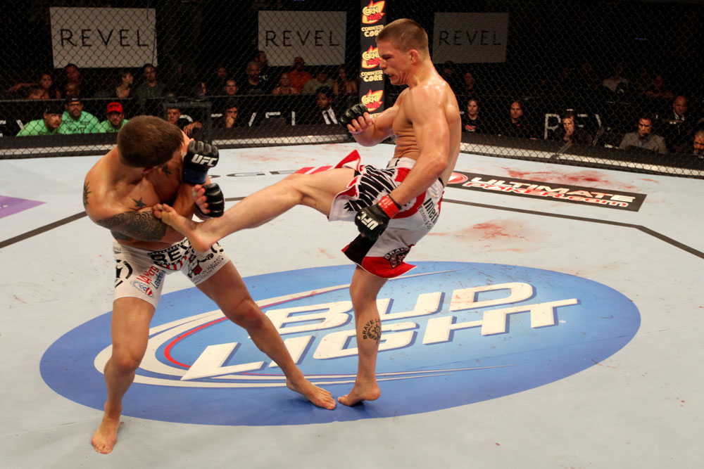 ATLANTIC CITY, NJ - JUNE 22: Rick Story (R) kicks Brock Jardine (L) in a welterweight bout during UFC on FX 4 at Revel Casino on June 22, 2012 in Atlantic City, New Jersey.  (Photo by Nick Laham/Zuffa LLC/Zuffa LLC)