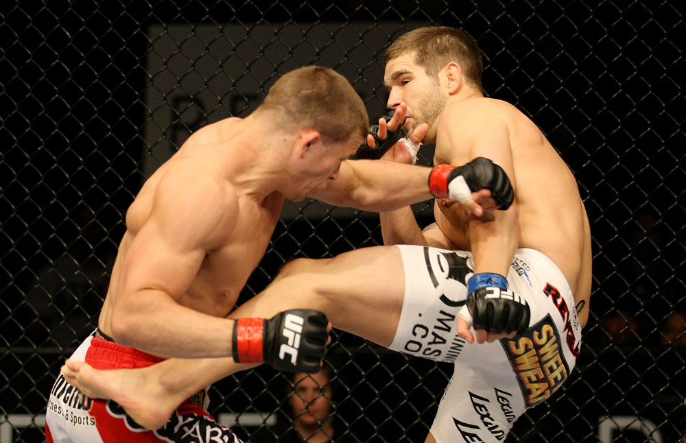 ATLANTIC CITY, NJ - JUNE 22:  Brock Jardine (R) kicks Rick Story (L) who hits him with a punch in a welterweight bout during UFC on FX 4 at Revel Casino on June 22, 2012 in Atlantic City, New Jersey.  (Photo by Nick Laham/Zuffa LLC/Zuffa LLC)