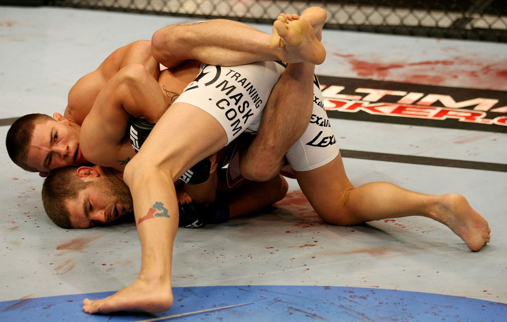 ATLANTIC CITY, NJ - JUNE 22:  Rick Story (T) tries to take the back of Brock Jardine (B) in a welterweight bout during UFC on FX 4 at Revel Casino on June 22, 2012 in Atlantic City, New Jersey.  (Photo by Nick Laham/Zuffa LLC/Zuffa LLC)