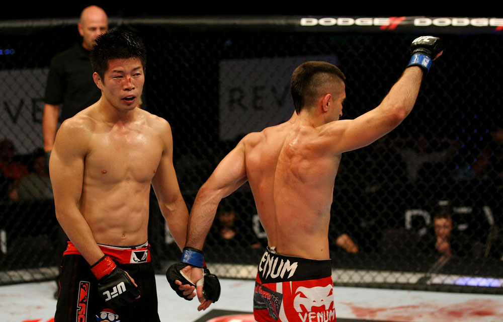 ATLANTIC CITY, NJ - JUNE 22:  Hatsu Hioki (L) walks away as Ricardo Lamas (R) celebrates after the third round of their featherweight bout during UFC on FX 4 at Revel Casino on June 22, 2012 in Atlantic City, New Jersey.  (Photo by Nick Laham/Zuffa LLC/Zuffa LLC)