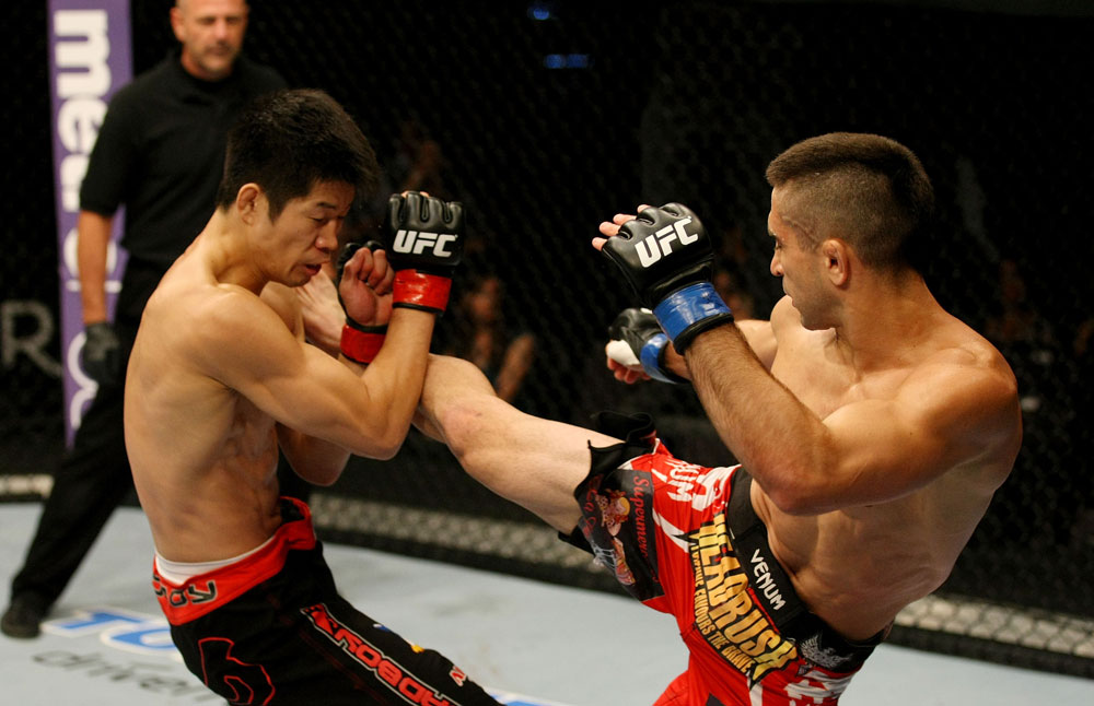 ATLANTIC CITY, NJ - JUNE 22: Ricardo Lamas (R) kicks Hatsu Hioki (L) in a featherweight bout during UFC on FX 4 at Revel Casino on June 22, 2012 in Atlantic City, New Jersey.  (Photo by Nick Laham/Zuffa LLC/Zuffa LLC)