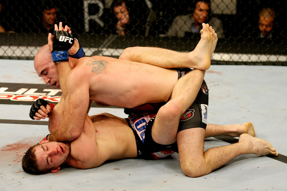ATLANTIC CITY, NJ - JUNE 22:  Brian Ebersole (T) puts an elbow to the face of T.J. Waldburger (B) while grappling in a welterweight bout during UFC on FX 4 at Revel Casino on June 22, 2012 in Atlantic City, New Jersey.  (Photo by Nick Laham/Zuffa LLC/Zuffa LLC)