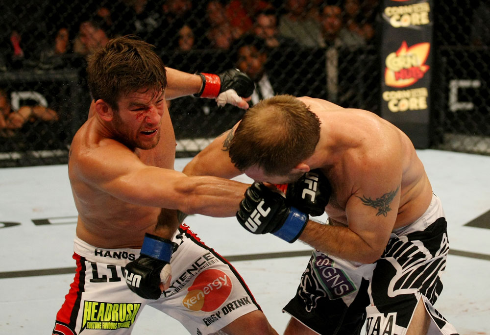 ATLANTIC CITY, NJ - JUNE 22: Sam Stout (L) punches Spencer Fisher (R) in a lightweight bout during UFC on FX 4 at Revel Casino on June 22, 2012 in Atlantic City, New Jersey. (Photo by Nick Laham/Zuffa LLC/Zuffa LLC)