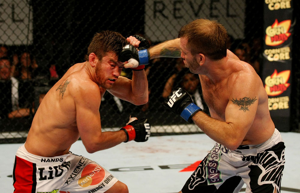 ATLANTIC CITY, NJ - JUNE 22:  Spencer Fisher (R) punches Sam Stout (L) in a lightweight bout during UFC on FX 4 at Revel Casino on June 22, 2012 in Atlantic City, New Jersey.  (Photo by Nick Laham/Zuffa LLC/Zuffa LLC)
