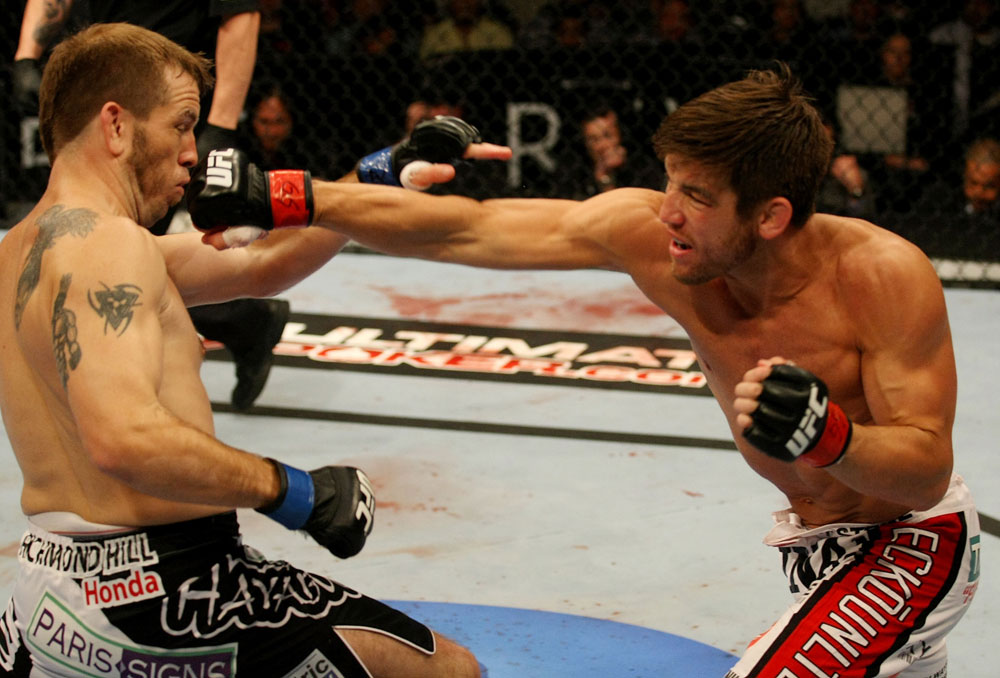 ATLANTIC CITY, NJ - JUNE 22: Sam Stout (R) punches Spencer Fisher (L) in a lightweight bout during UFC on FX 4 at Revel Casino on June 22, 2012 in Atlantic City, New Jersey.  (Photo by Nick Laham/Zuffa LLC/Zuffa LLC)