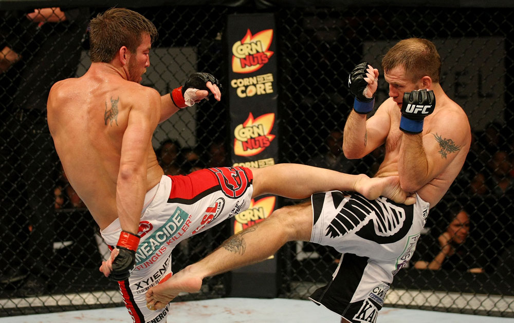 ATLANTIC CITY, NJ - JUNE 22: Sam Stout (L) exchanges kicks with Spencer Fisher (R) in a lightweight bout during UFC on FX 4 at Revel Casino on June 22, 2012 in Atlantic City, New Jersey. (Photo by Nick Laham/Zuffa LLC/Zuffa LLC)