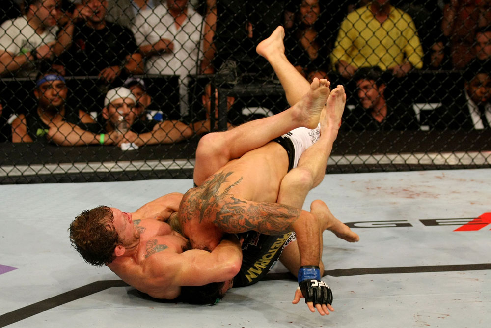 ATLANTIC CITY, NJ - JUNE 22: Gray Maynard (L) attempts a guillotine choke on Clay Guida (R) in the main event lightweight bout during UFC on FX 4 at Revel Casino on June 22, 2012 in Atlantic City, New Jersey.  (Photo by Nick Laham/Zuffa LLC/Zuffa LLC)