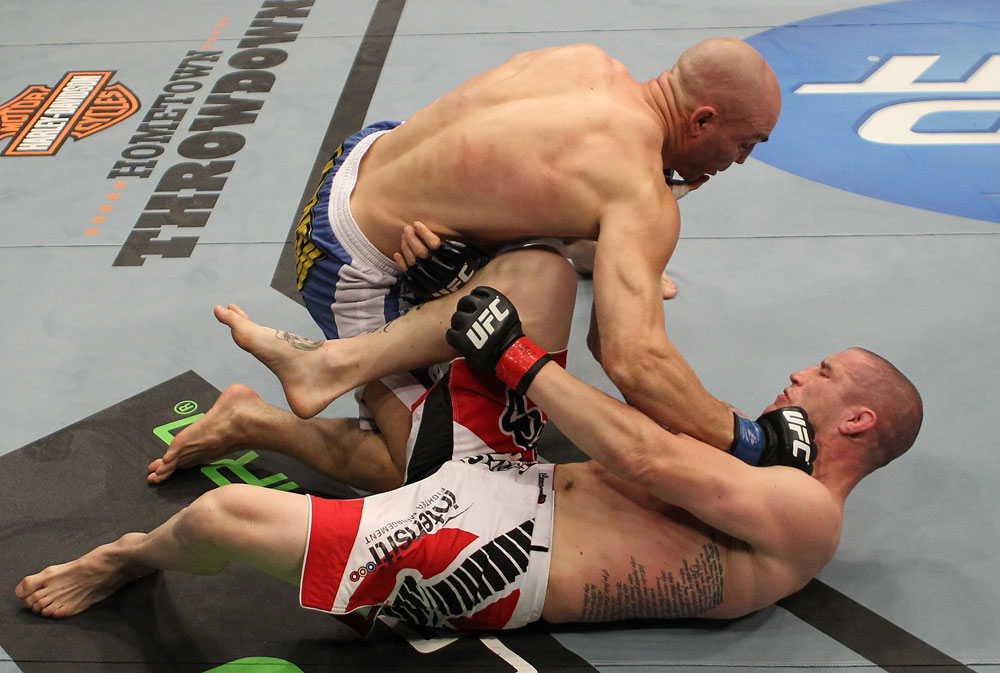SUNRISE, FL - JUNE 08:   Sean Pierson (top) punches Jake Hecht in Welterweight bout during the UFC on FX 3 event at Bank Atlantic Center on June 8, 2012 in Sunrise, Florida.  (Photo by Josh Hedges/Zuffa LLC/Zuffa LLC via Getty Images)