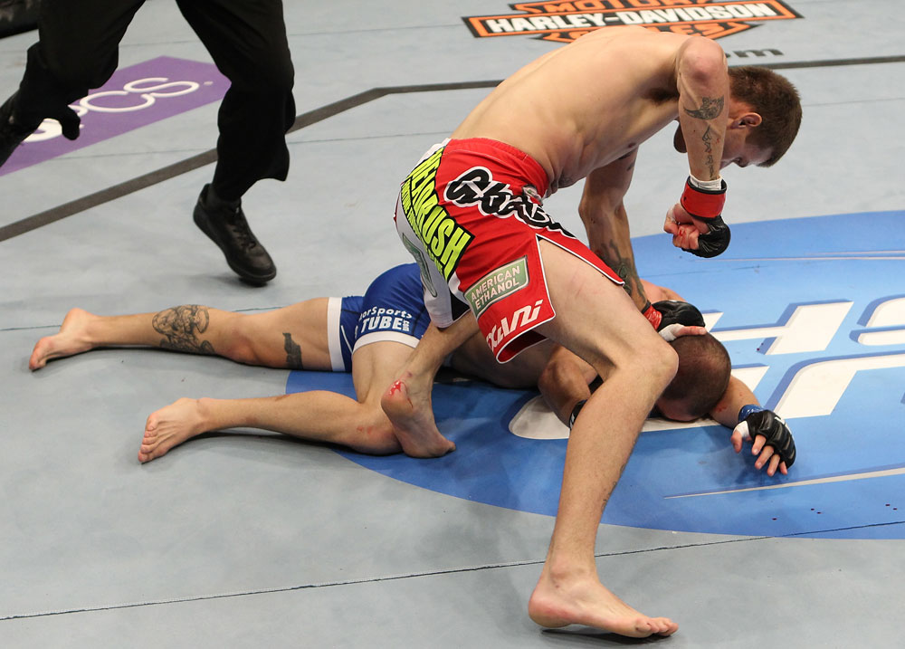 SUNRISE, FL - JUNE 08:   (R-L) Tim Means punches Justin Salas in Lightweight bout during the UFC on FX 3 event at Bank Atlantic Center on June 8, 2012 in Sunrise, Florida.  (Photo by Josh Hedges/Zuffa LLC/Zuffa LLC via Getty Images)