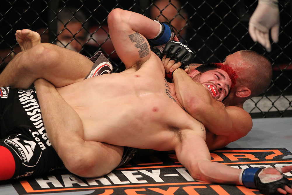 SUNRISE, FL - JUNE 08:   (R-L) Dustin Pague submits Jared Papazian with a rear choke in Bantamweight bout during the UFC on FX 3 event at Bank Atlantic Center on June 8, 2012 in Sunrise, Florida.  (Photo by Josh Hedges/Zuffa LLC/Zuffa LLC via Getty Images)