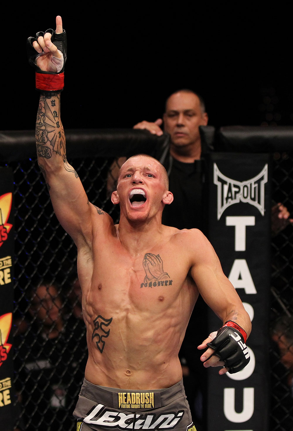 SUNRISE, FL - JUNE 08:   Dustin Pague reacts after submitting Jared Papazian with a rear choke in Bantamweight bout during the UFC on FX 3 event at Bank Atlantic Center on June 8, 2012 in Sunrise, Florida.  (Photo by Josh Hedges/Zuffa LLC/Zuffa LLC via Getty Images)