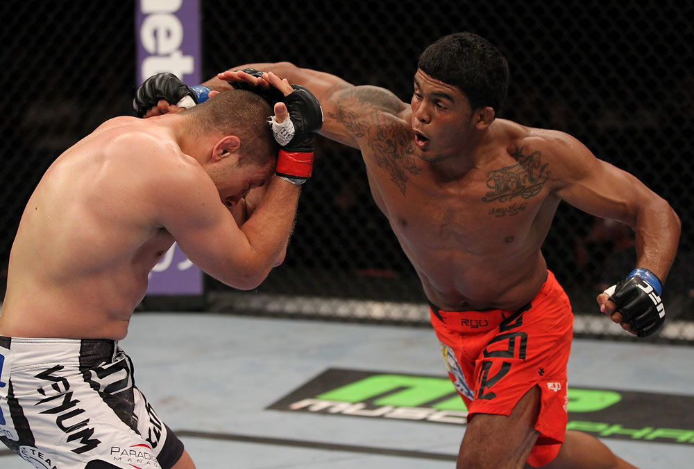 SUNRISE, FL - JUNE 08:   (R-L) Carlos Eduardo Rocha punches Mike Pierce in a Welterweight bout during the UFC on FX 3 event at Bank Atlantic Center on June 8, 2012 in Sunrise, Florida.  (Photo by Josh Hedges/Zuffa LLC/Zuffa LLC via Getty Images)