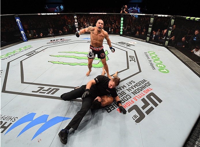 ADELAIDE, AUSTRALIA - MAY 10: <a href='../fighter/robert-whittaker'>Robert Whittaker</a> celebrates his knockout victory over <a href='../fighter/Brad-Tavares'>Brad Tavares</a> in their middleweight bout during the UFC Fight Night event at the Adelaide Entertainment Centre on May 10, 2015 in Adelaide, Australia. (Photo by Josh Hedges/Zuffa LLC/Zuffa LLC via Getty Images)