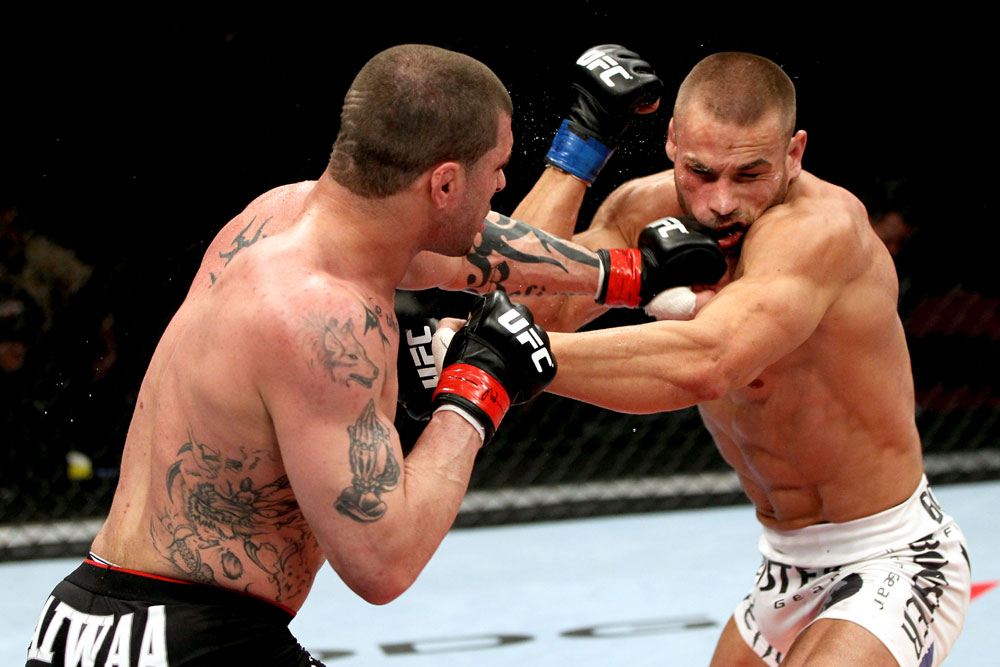 EAST RUTHERFORD, NJ - MAY 05: Mike Massenzio punches Karlos Vemola during thier Middleweight bout at Izod Center on May 5, 2012 in East Rutherford, New Jersey. (Photo by Josh Hedges/Zuffa LLC/Zuffa LLC via Getty Images)
