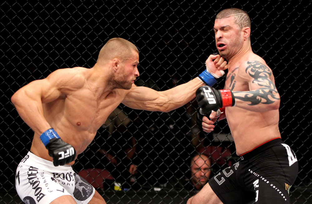EAST RUTHERFORD, NJ - MAY 05: Karlos Vemola punches Mike Massenzio during thier Middleweight bout at Izod Center on May 5, 2012 in East Rutherford, New Jersey. (Photo by Josh Hedges/Zuffa LLC/Zuffa LLC via Getty Images)