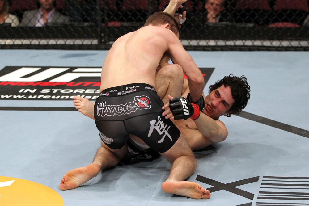 EAST RUTHERFORD, NJ - MAY 05: Nick Denis (Top) punches Roland Delorme (Bottom) during thier Bantamweight bout at Izod Center on May 5, 2012 in East Rutherford, New Jersey. (Photo by Josh Hedges/Zuffa LLC/Zuffa LLC via Getty Images)