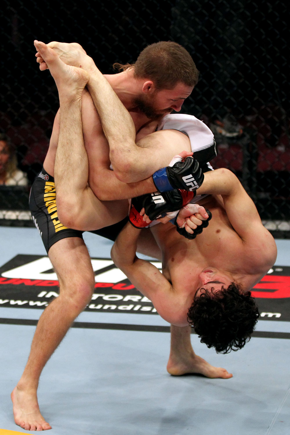 EAST RUTHERFORD, NJ - MAY 05: Nick Denis slams Roland Delorme to the ground during thier Bantamweight bout at Izod Center on May 5, 2012 in East Rutherford, New Jersey. (Photo by Josh Hedges/Zuffa LLC/Zuffa LLC via Getty Images)