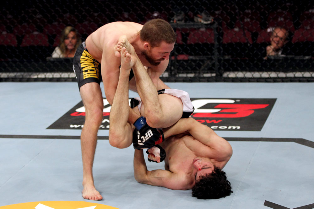 EAST RUTHERFORD, NJ - MAY 05: Nick Denis slams Roland Delorme to the ground during thier Bantamweight bout at Izod Center on May 5, 2012 in East Rutherford, New Jersey. (Photo by Josh Hedges/Zuffa LLC/Zuffa LLC via Getty Images)