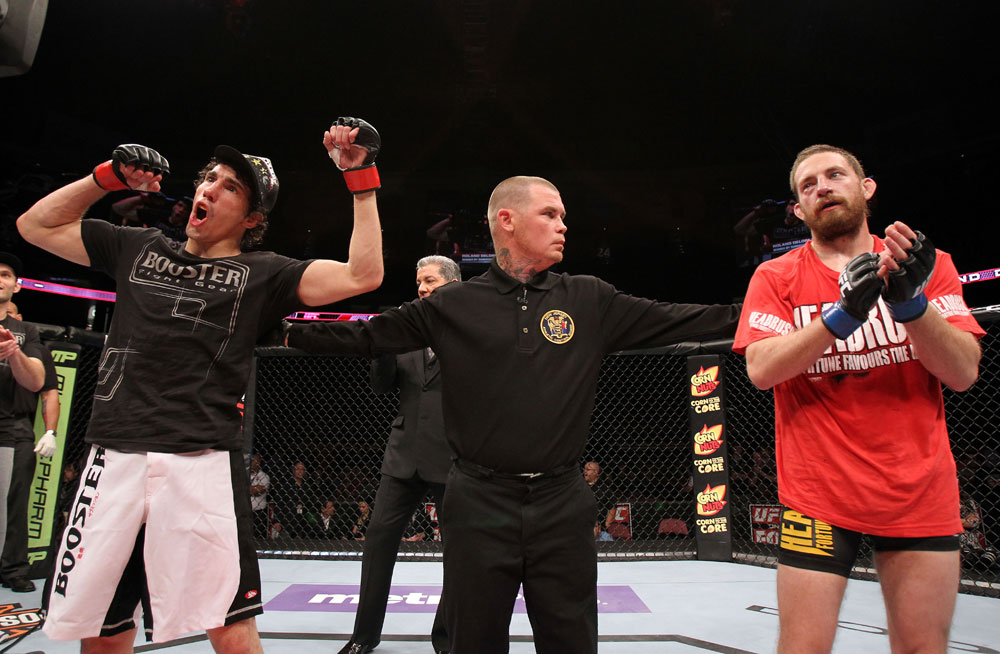 EAST RUTHERFORD, NJ - MAY 05: Roland Delorme (L) celebrates after defeating Nick Denis in thier Bantamweight bout at Izod Center on May 5, 2012 in East Rutherford, New Jersey. (Photo by Josh Hedges/Zuffa LLC/Zuffa LLC via Getty Images)