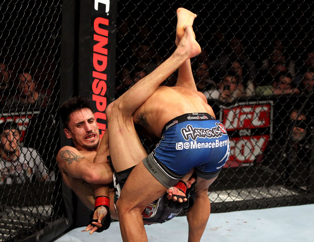 EAST RUTHERFORD, NJ - MAY 05: Dennis Bermudez slams Pablo Garza to the ground during thier Bantamweight bout at Izod Center on May 5, 2012 in East Rutherford, New Jersey. (Photo by Josh Hedges/Zuffa LLC/Zuffa LLC via Getty Images)