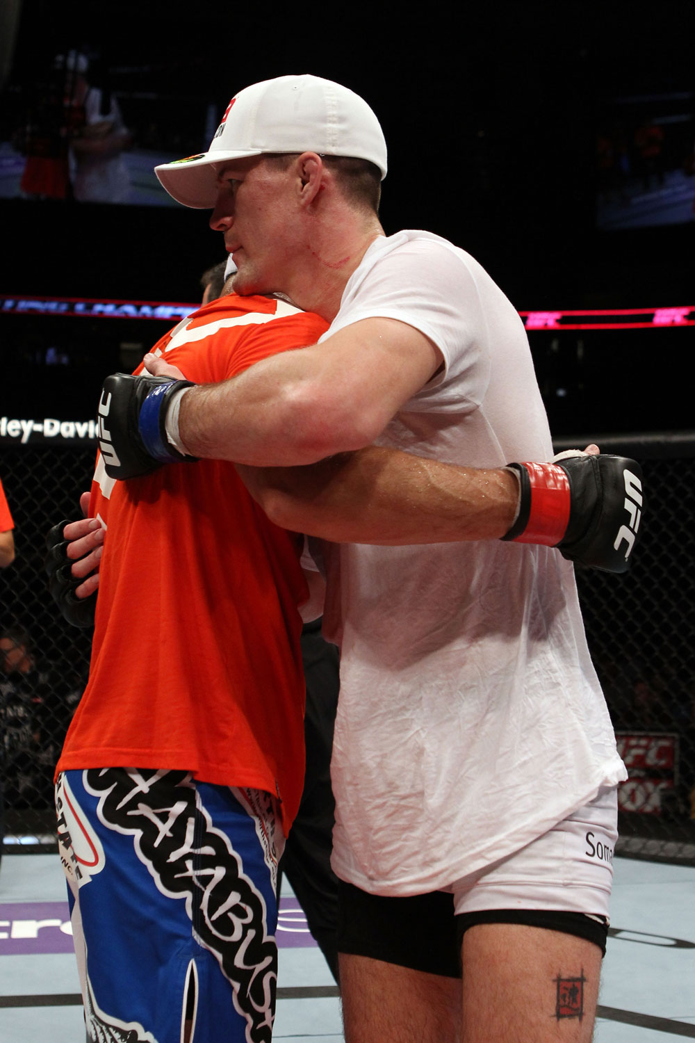 EAST RUTHERFORD, NJ - MAY 05: Danny Castillo (L) hugs John Cholish (R) after thier Lightweight bout at Izod Center on May 5, 2012 in East Rutherford, New Jersey. (Photo by Josh Hedges/Zuffa LLC/Zuffa LLC via Getty Images)