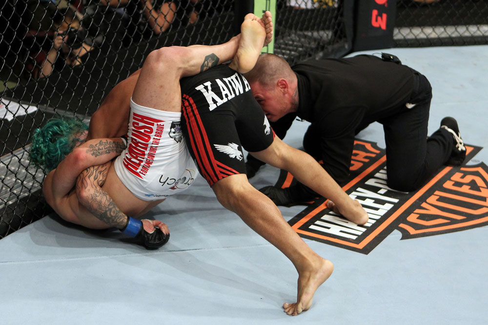 EAST RUTHERFORD, NJ - MAY 05: Louis Gaudinot chokes out John Lineker to defeat him in thier Flyweight bout at Izod Center on May 5, 2012 in East Rutherford, New Jersey. (Photo by Josh Hedges/Zuffa LLC/Zuffa LLC via Getty Images)