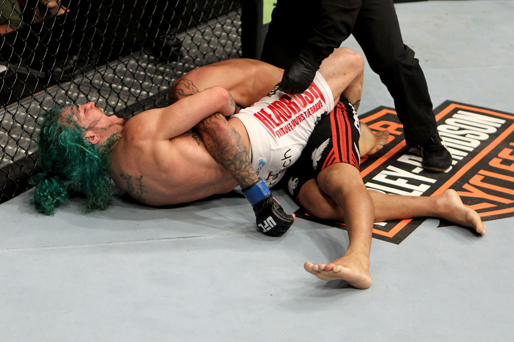 EAST RUTHERFORD, NJ - MAY 05: Louis Gaudinot chokes out John Lineker to defeat him in thier Flyweight bout at Izod Center on May 5, 2012 in East Rutherford, New Jersey. (Photo by Josh Hedges/Zuffa LLC/Zuffa LLC via Getty Images)