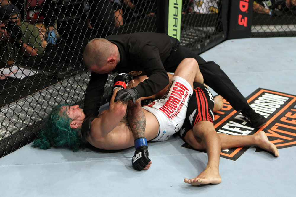 EAST RUTHERFORD, NJ - MAY 05: Louis Gaudinot chokes out John Lineker to defeat him in thier Flyweight bout at Izod Center on May 5, 2012 in East Rutherford, New Jersey. (Photo by Josh Hedges/Zuffa LLC/Zuffa LLC via Getty Images)