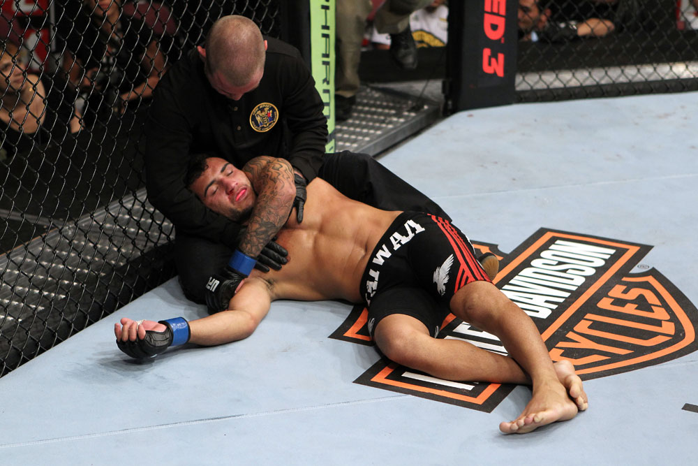 EAST RUTHERFORD, NJ - MAY 05: John Lineker gets assisted after being choked out by Louis Gaudinot during thier Flyweight bout at Izod Center on May 5, 2012 in East Rutherford, New Jersey. (Photo by Josh Hedges/Zuffa LLC/Zuffa LLC via Getty Images)