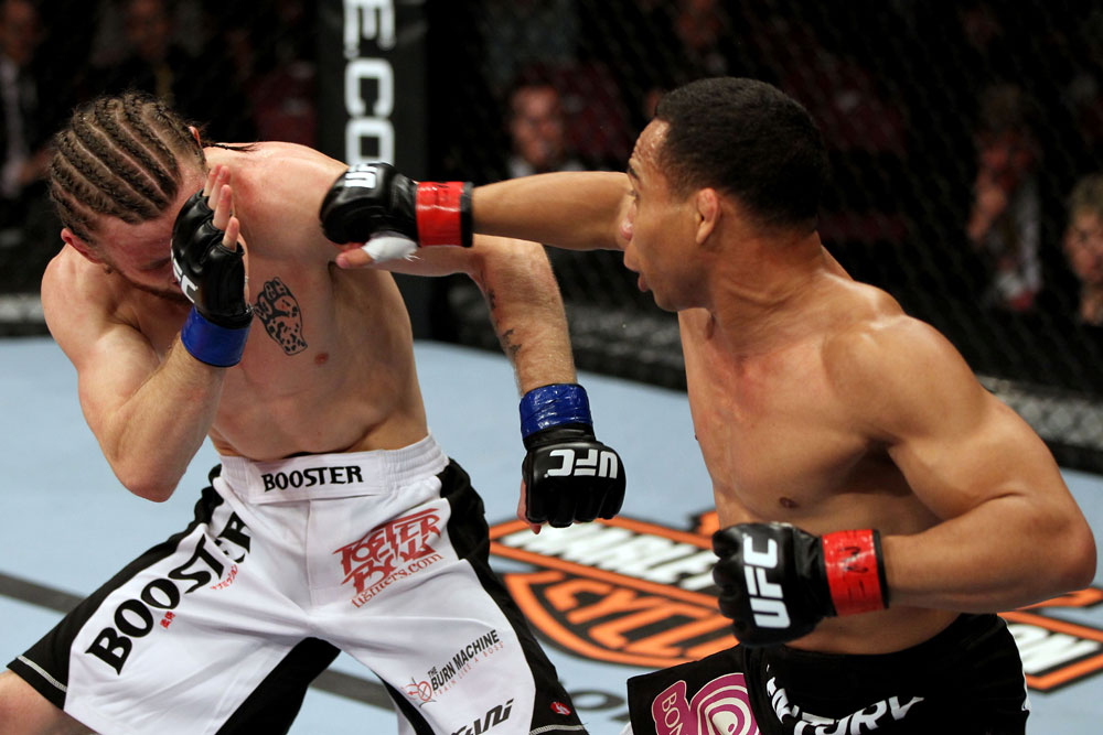 EAST RUTHERFORD, NJ - MAY 05: John Dodson (R) punches Timothy Elliott (L) during thier Flyweight bout at Izod Center on May 5, 2012 in East Rutherford, New Jersey. (Photo by Josh Hedges/Zuffa LLC/Zuffa LLC via Getty Images)