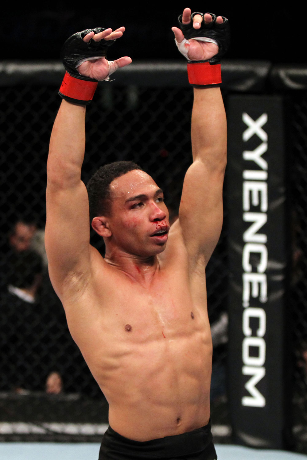 EAST RUTHERFORD, NJ - MAY 05: John Dodson celebrates after defeating Timothy Elliott during thier Flyweight bout at Izod Center on May 5, 2012 in East Rutherford, New Jersey. (Photo by Josh Hedges/Zuffa LLC/Zuffa LLC via Getty Images)