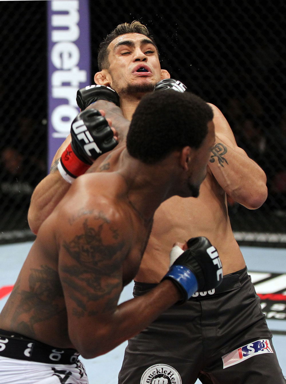 EAST RUTHERFORD, NJ - MAY 05: Michael Johnson punches Tony Ferguson during thier Flyweight bout at Izod Center on May 5, 2012 in East Rutherford, New Jersey. (Photo by Josh Hedges/Zuffa LLC/Zuffa LLC via Getty Images)