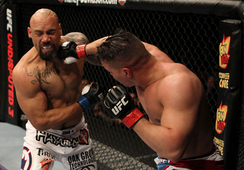 EAST RUTHERFORD, NJ - MAY 05: Pat Barry (R) punches Lavar Johnson (L) during thier Heavyweight bout at Izod Center on May 5, 2012 in East Rutherford, New Jersey. (Photo by Josh Hedges/Zuffa LLC/Zuffa LLC via Getty Images)