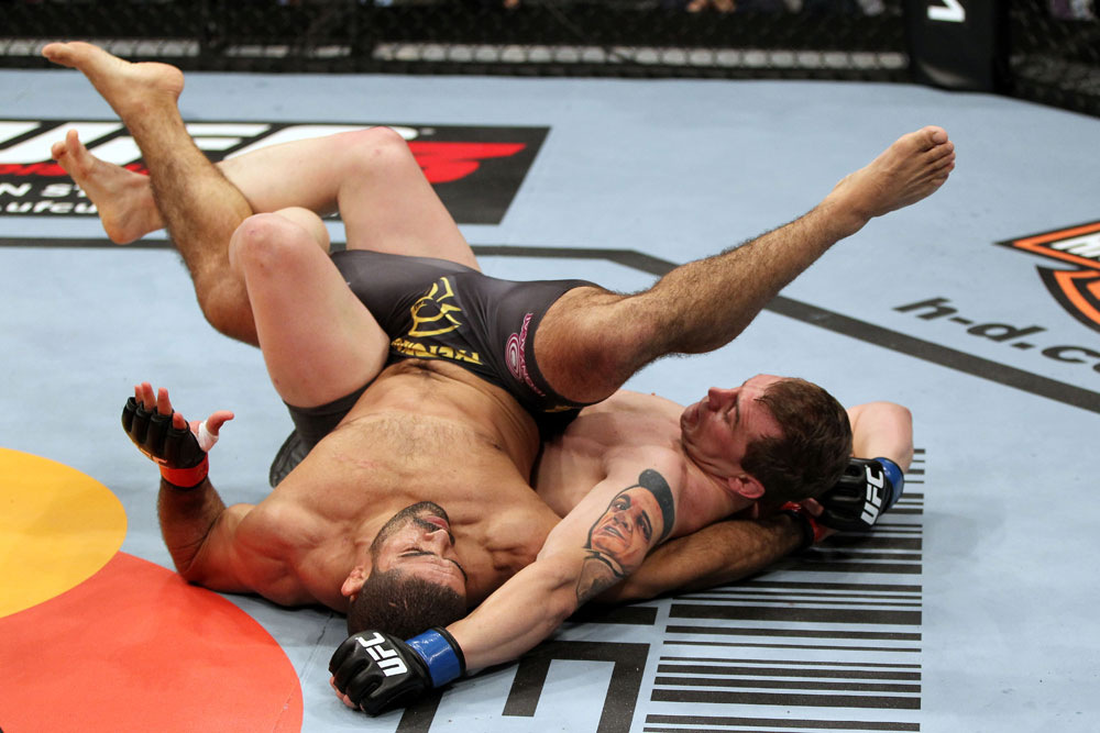 EAST RUTHERFORD, NJ - MAY 05: Alan Belcher (R) wrestles Rousimar Palhares (L) to the ground during thier Middleweight bout at Izod Center on May 5, 2012 in East Rutherford, New Jersey. (Photo by Josh Hedges/Zuffa LLC/Zuffa LLC via Getty Images)