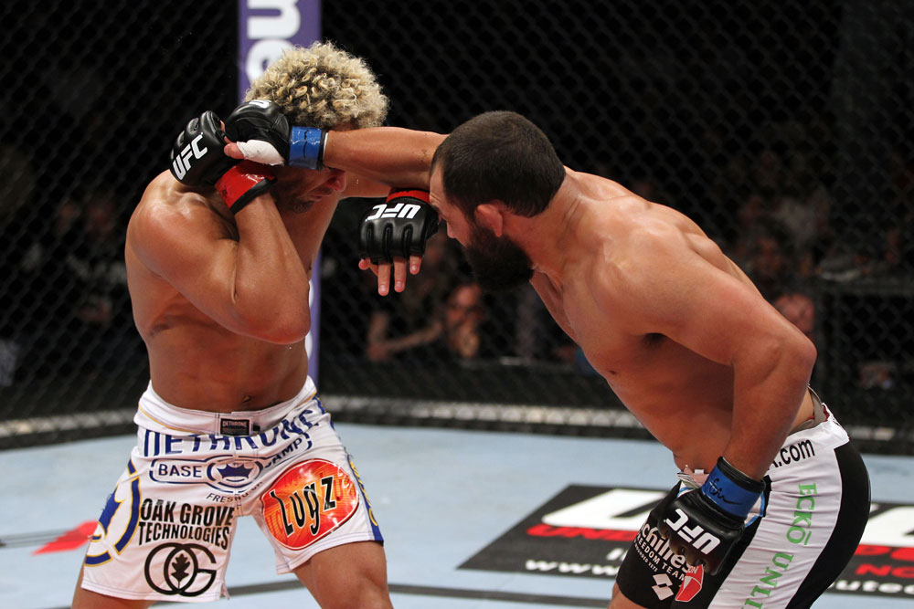 EAST RUTHERFORD, NJ - MAY 05: Johny Hendricks (R) punches Josh Koscheck (L) during thier Welterweight bout at Izod Center on May 5, 2012 in East Rutherford, New Jersey. (Photo by Josh Hedges/Zuffa LLC/Zuffa LLC via Getty Images)
