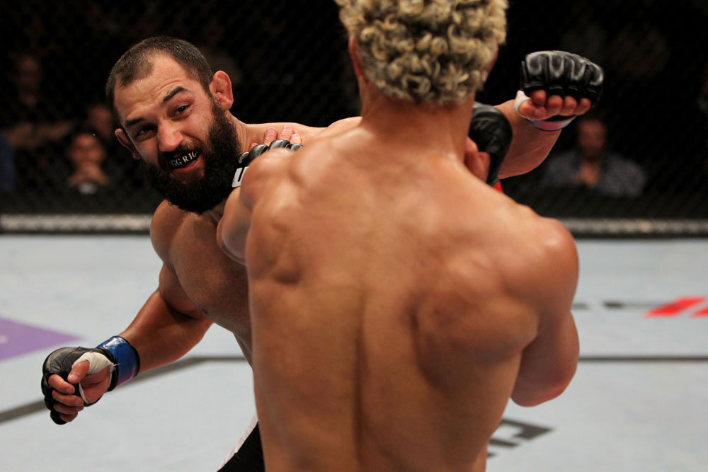 EAST RUTHERFORD, NJ - MAY 05: Johny Hendricks (L) punches Josh Koscheck (R) during thier Welterweight bout at Izod Center on May 5, 2012 in East Rutherford, New Jersey. (Photo by Josh Hedges/Zuffa LLC/Zuffa LLC via Getty Images)