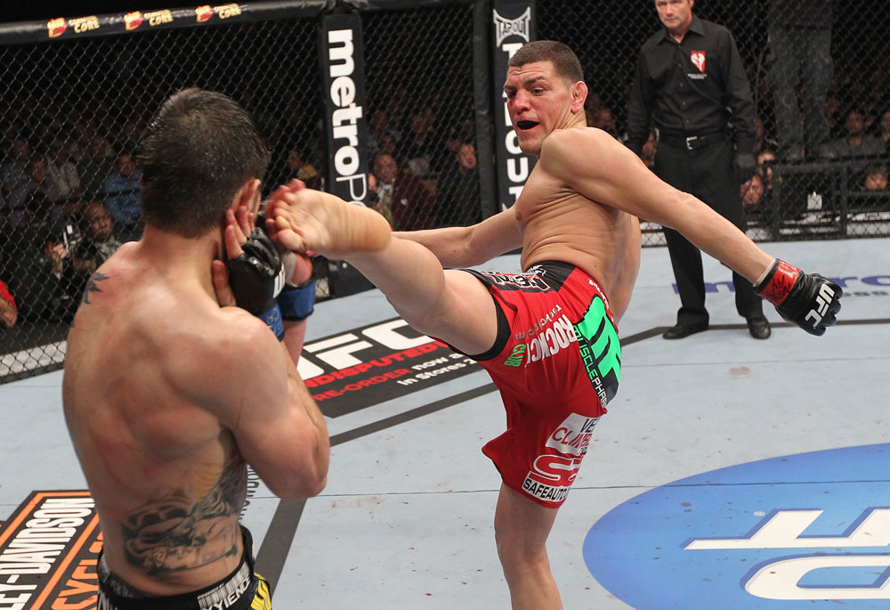 LAS VEGAS - FEBRUARY 04:  (R-L) Nick Diaz kicks Carlos Condit during the UFC 143 event at Mandalay Bay Events Center on February 4, 2012 in Las Vegas, Nevada.  (Photo by Nick Laham/Zuffa LLC/Zuffa LLC via Getty Images) *** Local Caption *** Nick Diaz; Carlos Condit
