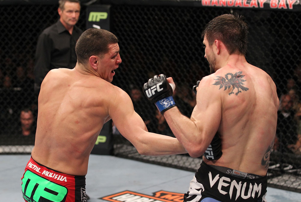 LAS VEGAS - FEBRUARY 04:  Nick Diaz (left) punches Carlos Condit during the UFC 143 event at Mandalay Bay Events Center on February 4, 2012 in Las Vegas, Nevada.  (Photo by Nick Laham/Zuffa LLC/Zuffa LLC via Getty Images) *** Local Caption *** Nick Diaz; Carlos Condit