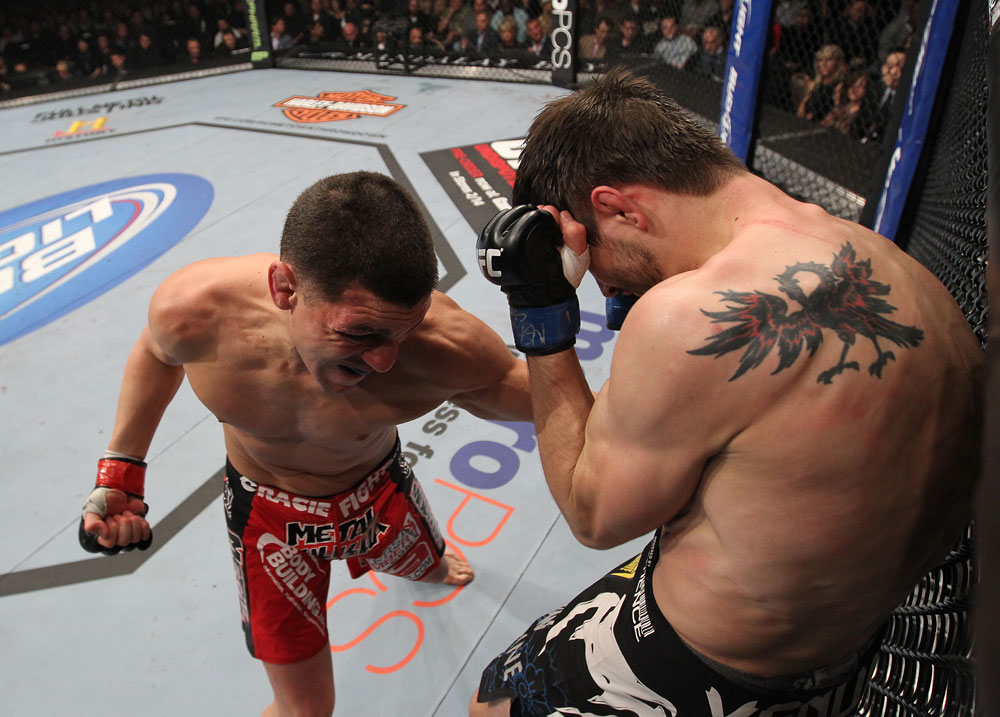 LAS VEGAS - FEBRUARY 04:  Nick Diaz (left) punches Carlos Condit during the UFC 143 event at Mandalay Bay Events Center on February 4, 2012 in Las Vegas, Nevada.  (Photo by Nick Laham/Zuffa LLC/Zuffa LLC via Getty Images) *** Local Caption *** Nick Diaz; Carlos Condit