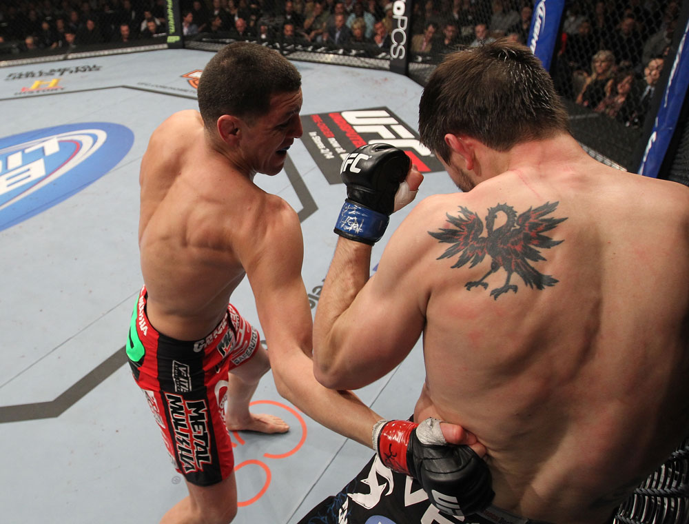 LAS VEGAS - FEBRUARY 04:  Nick Diaz (left) punches Carlos Condit during the UFC 143 event at Mandalay Bay Events Center on February 4, 2012 in Las Vegas, Nevada.  (Photo by Nick Laham/Zuffa LLC/Zuffa LLC via Getty Images) *** Local Caption *** Nick Diaz; Carlos Condit